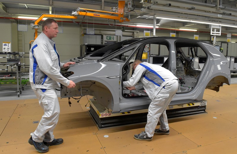 Employees work at a production line of a a new electric Volkswagen model ID.3 in Zwickau