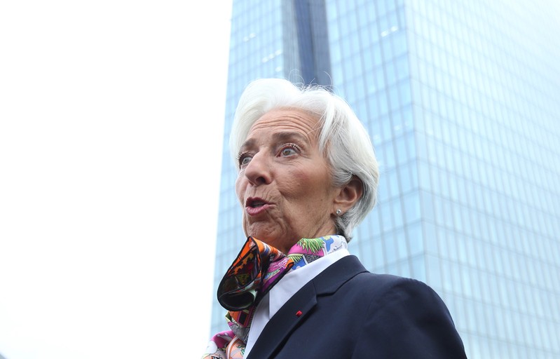 European Central Bank's President Lagarde answers journalists questions as she arrives at the