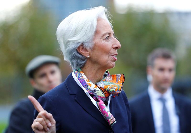 European Central Bank's President Lagarde answers journalists questions as she arrives at the