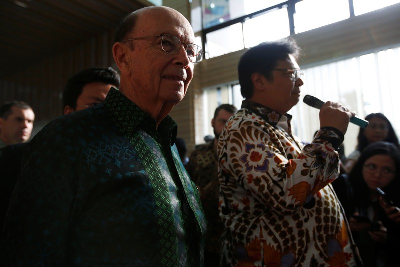 U.S. Commerce Secretary Wilbur Ross reacts as Indonesia's Chief Economic Minister Airlangga