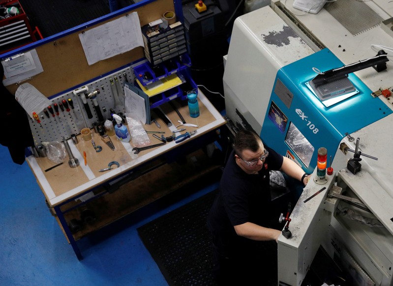 Engineer monitors a precision lathe at Swiftool Precision Engineering Ltd's facility near