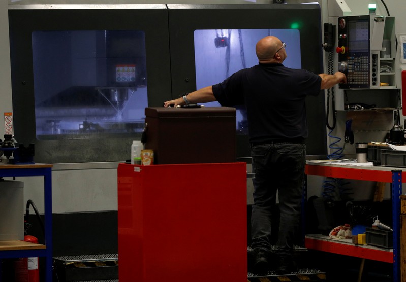 Engineer monitors a milling machine at Swiftool Precision Engineering Ltd's facility near