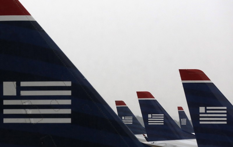 U.S. Airways jets are seen early in the morning at Reagan National Airport in Washington