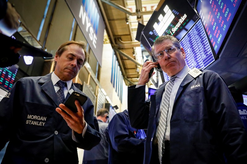 Traders work on the floor at the NYSE in New York