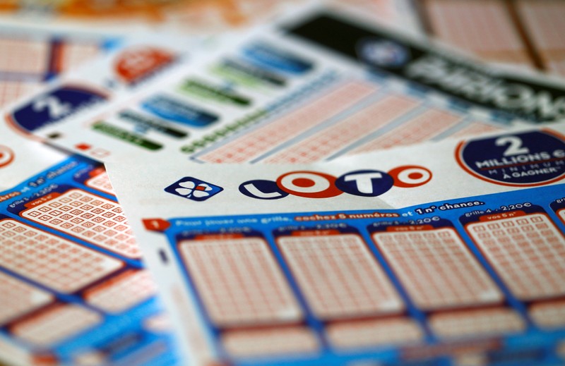 Logo and grids of French lottery group Francaise des Jeux are pictured in this illustration