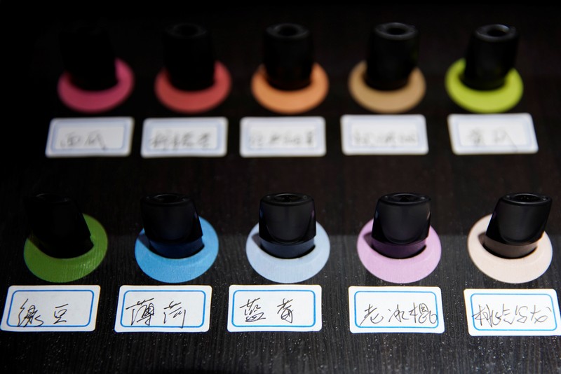 Pods of different flavors are seen on display at an authorized reseller store of Chinese