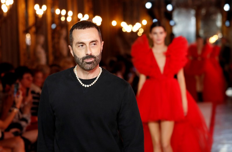 FILE PHOTO: Designer Giambattista Valli walks on catwalk followed by U.S. model Kendall Jenner