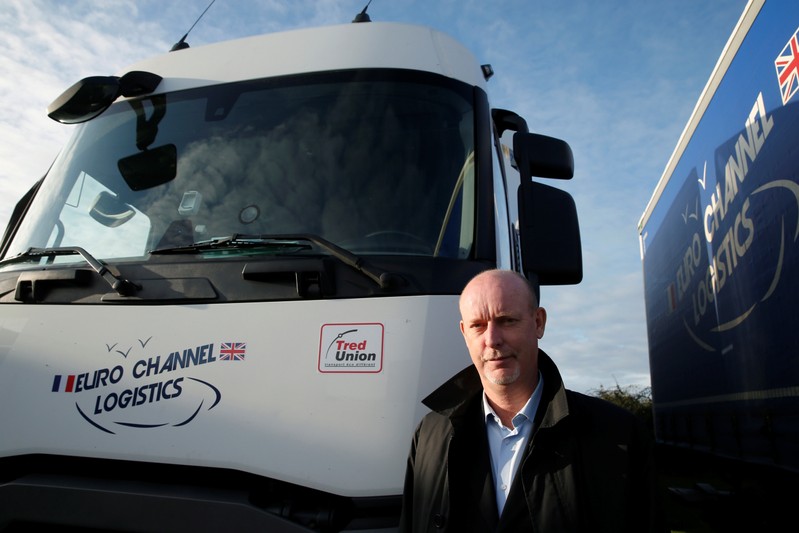 Bruno Beliard, founder and CEO of Euro Channel Logistics, poses in front of his trucks in