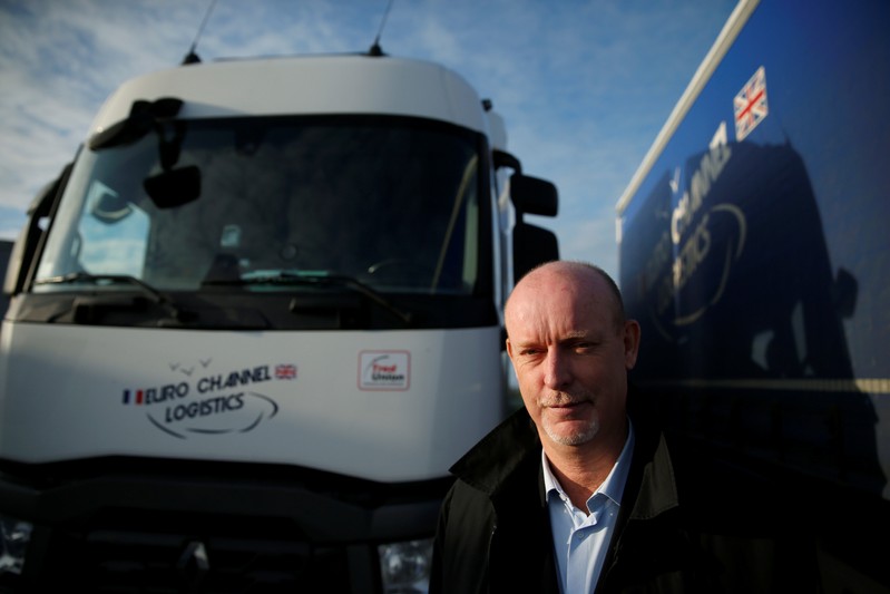 Bruno Beliard, founder and CEO of Euro Channel Logistics, poses in front of his trucks in