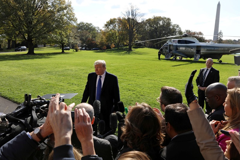 U.S. President Donald Trump boards Marine One to depart for travel to Georgia from the South