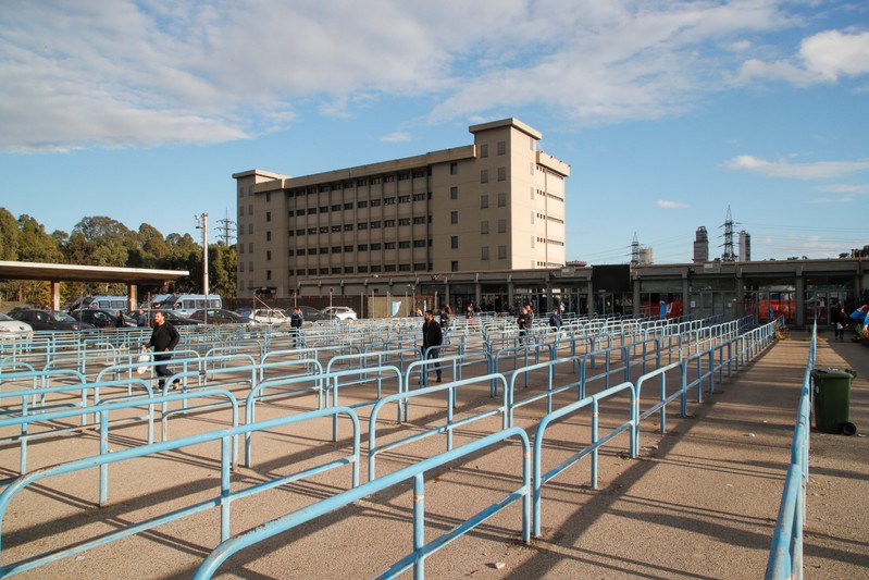 Ilva steel plant workers are seen outside the plant during a 24-hour strike against