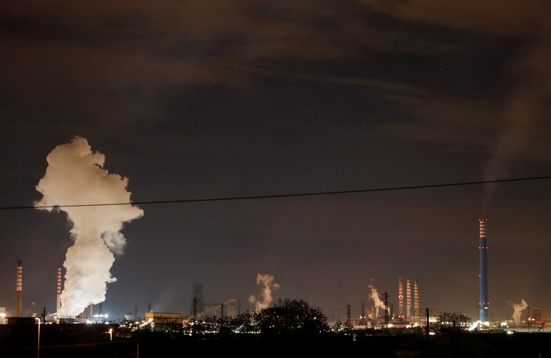 Steam comes out of the chimneys of Ilva steel plant in Taranto