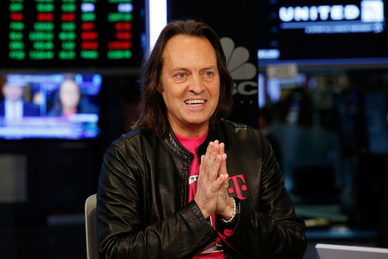 T-Mobile CEO John Legere speaks on the floor of the New York Stock Exchange in New York