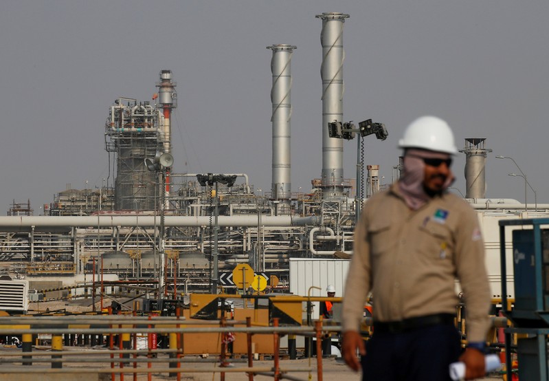An employee looks on at Saudi Aramco oil facility in Abqaiq