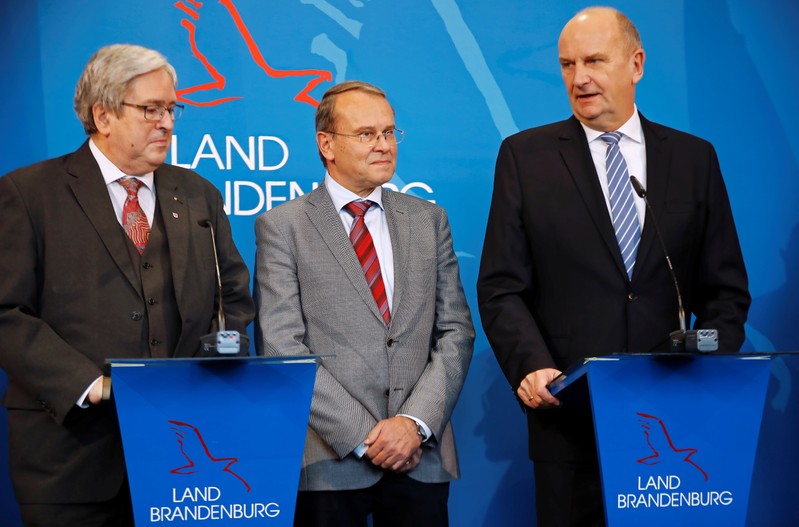 Brandenburg's Prime Minister Dietmar Woidke, state Minister for Economy and Energy Joerg