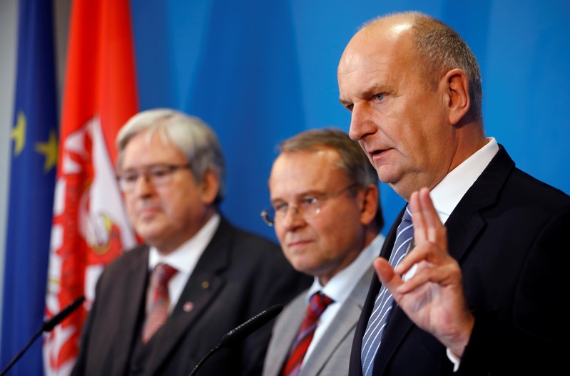 Brandenburg's Prime Minister Dietmar Woidke, state Minister for Economy and Energy Joerg