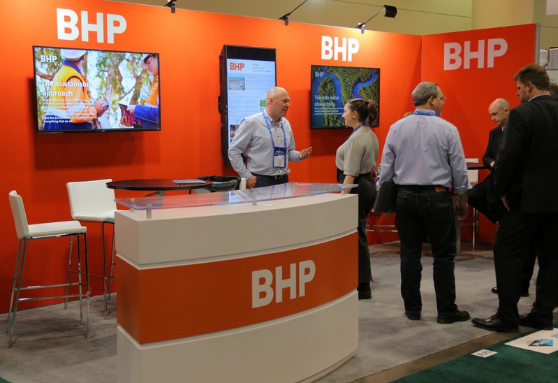 FILE PHOTO: Visitors to the BHP booth speak with representatives during the PDAC convention in