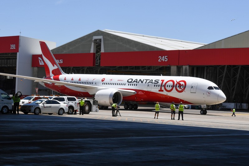 Qantas flight QF7879, which flew direct from London to Sydney, arrives at the hangar for the