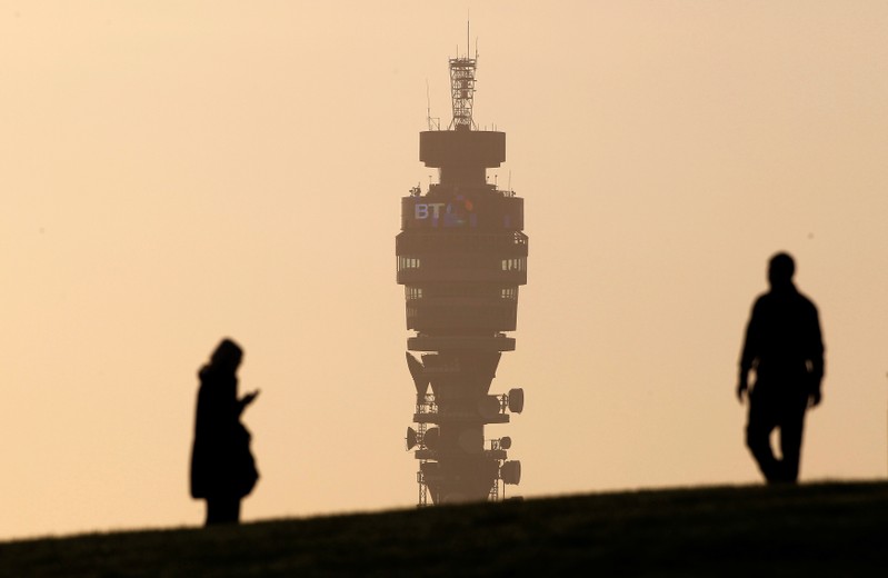 FILE PHOTO: The BT communication tower is seen in the background as people walk on Primrose
