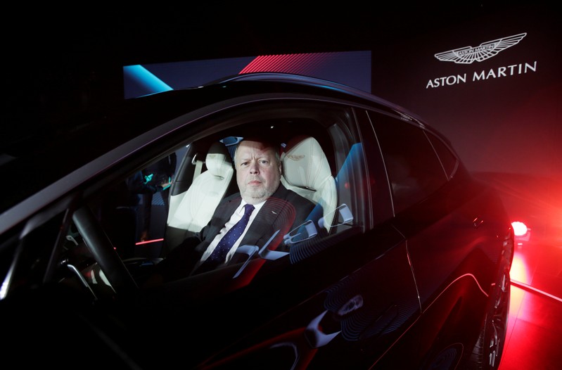 CEO of Aston Martin Andy Palmer poses for a photo inside the company's first sport utility