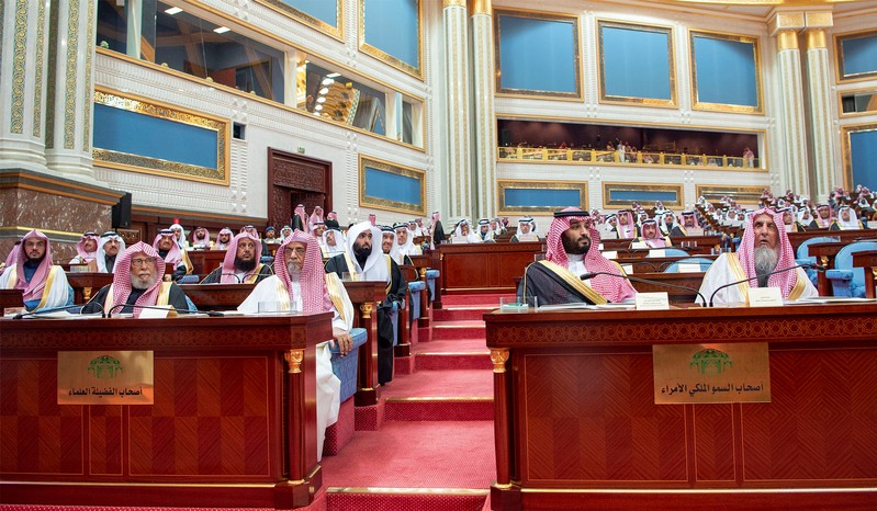 Saudi Crown Prince Mohammed bin Salman sits next to Saudi Arabia's Grand Mufti Sheikh Abdulaziz