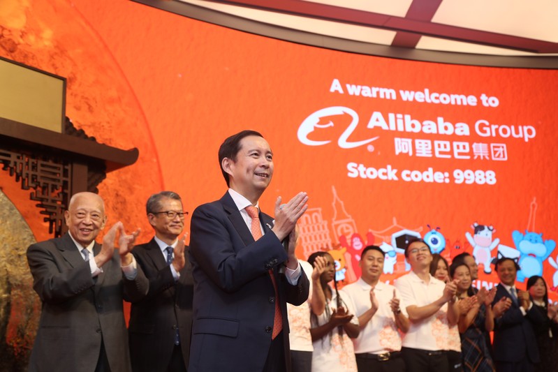 Daniel Zhang, Paul Chan and Tung Chee-hwa attend Alibaba Group's listing ceremony at the Hong