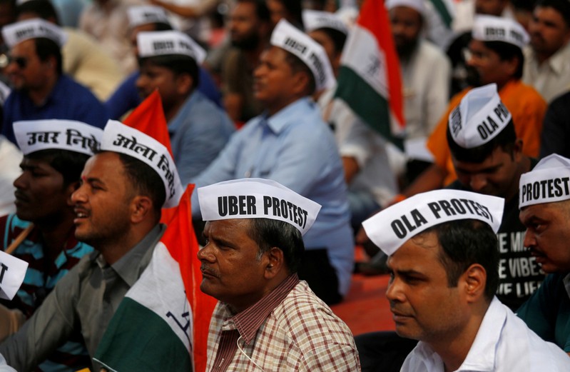 FILE PHOTO: Ola and Uber drivers are seen wearing caps during a protest against Ola and Uber in