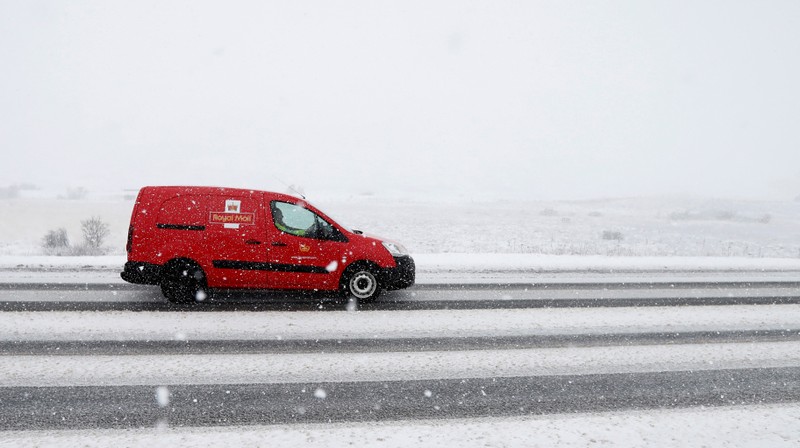 A Royal Mail van drives through the Drumochter Pass, Scotland