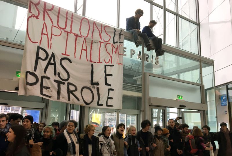 French activists protest the annual Black Friday shopping frenzy in Paris