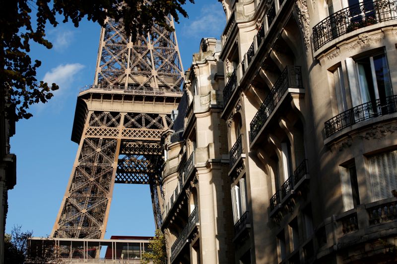 FILE PHOTO: The Eiffel Tower stands near luxury Haussmannian buildings in the 7th