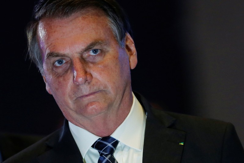Brazil's President Jair Bolsonaro looks on during the event 