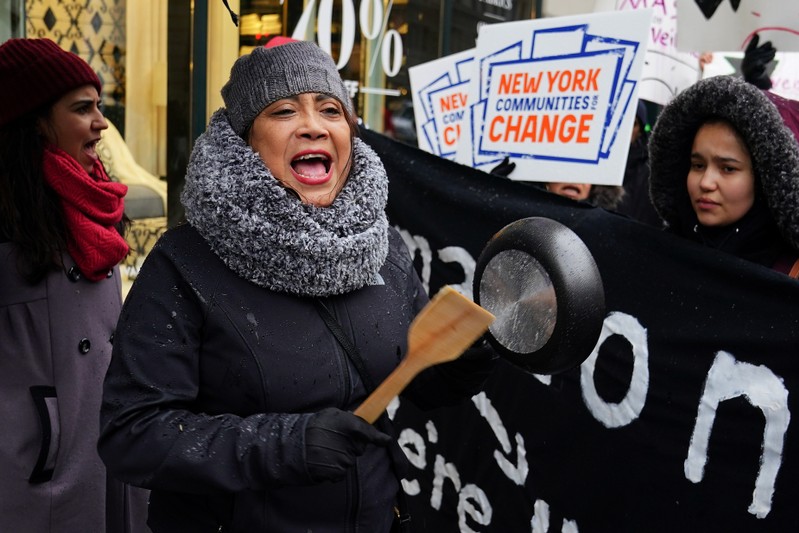 A woman takes part in a rally against Amazon and their business practices in the Manhattan