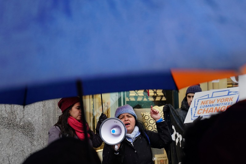 A woman takes part in a rally against Amazon and their business practices in the Manhattan