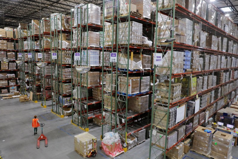 Amazon workers perform their jobs inside of an Amazon fulfillment center on Cyber Monday in