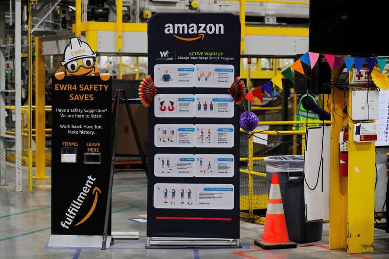 Exercise tips and safety instructions are displayed inside of an Amazon fulfillment center on