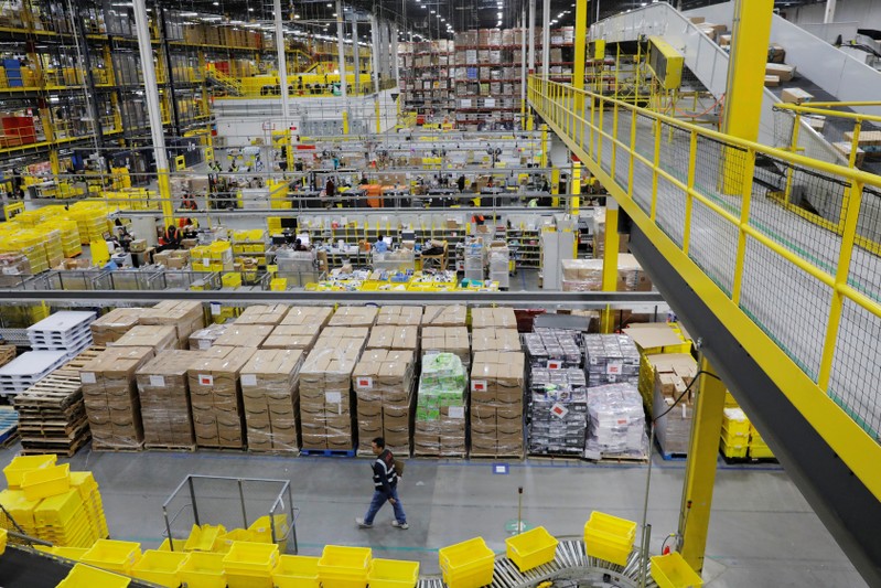 Amazon workers perform their jobs inside of an Amazon fulfillment center on Cyber Monday in