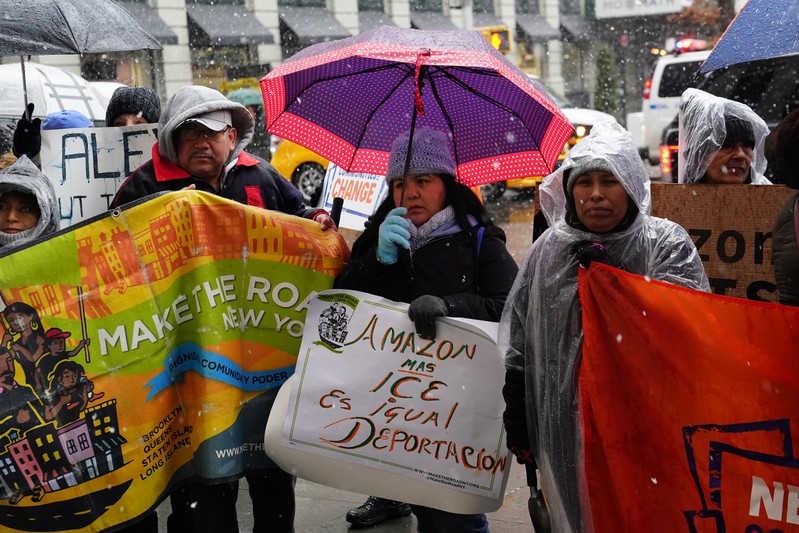 People take part in a rally against Amazon and their business practices in the Manhattan