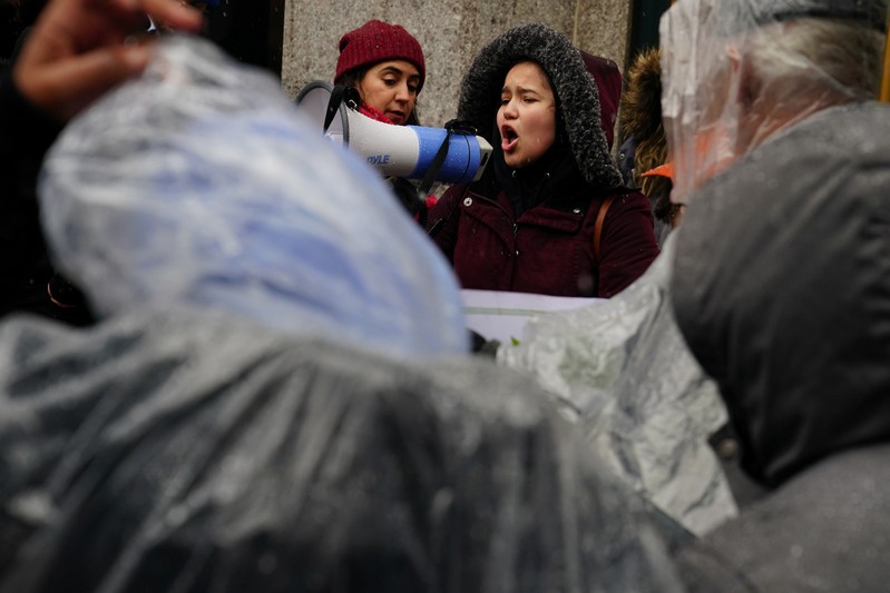 A woman takes part in a rally against Amazon and their business practices in the Manhattan