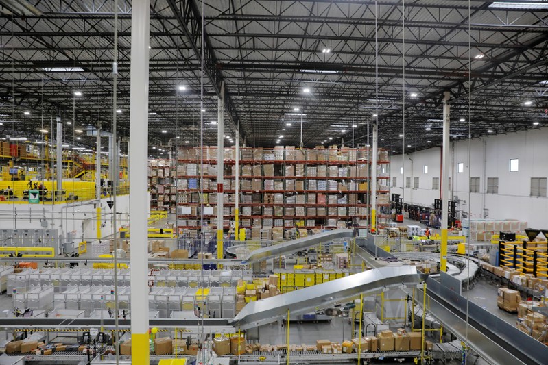 Amazon workers perform their jobs inside of an Amazon fulfillment center on Cyber Monday in