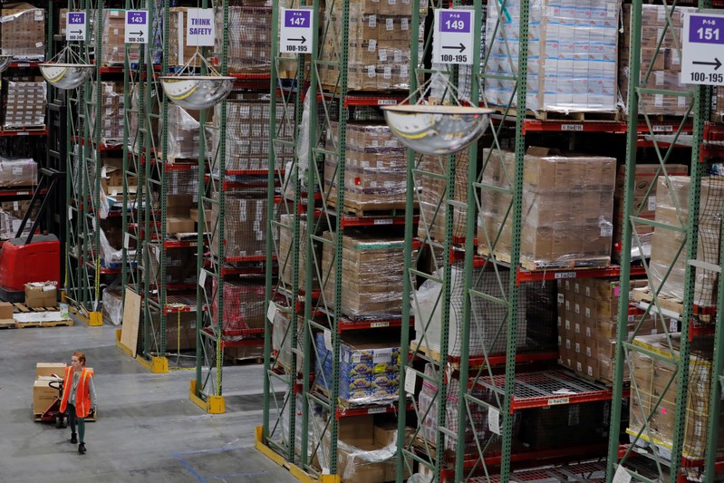 Amazon workers perform their jobs inside of an Amazon fulfillment center on Cyber Monday in