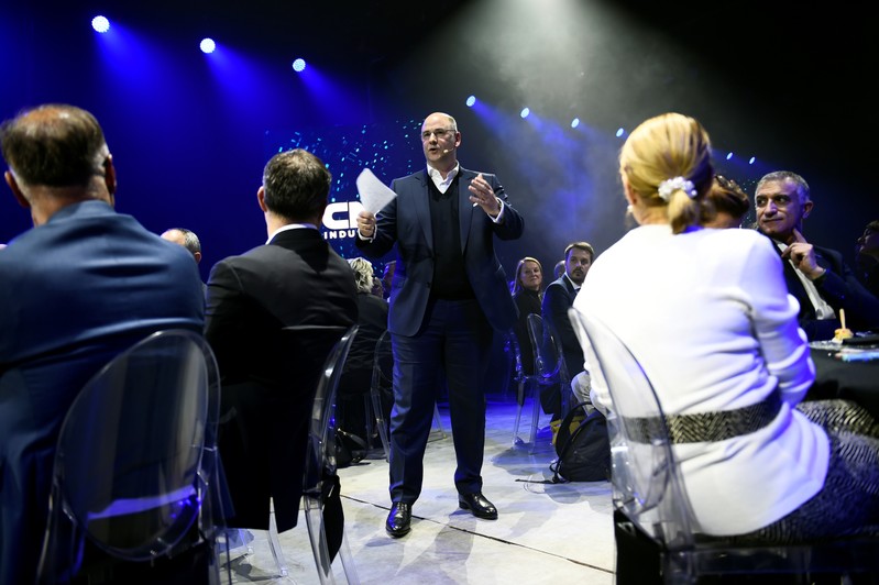 CEO of Italian-American CNH Industrial Hubertus Muhlhauser speaks during a dinner held to