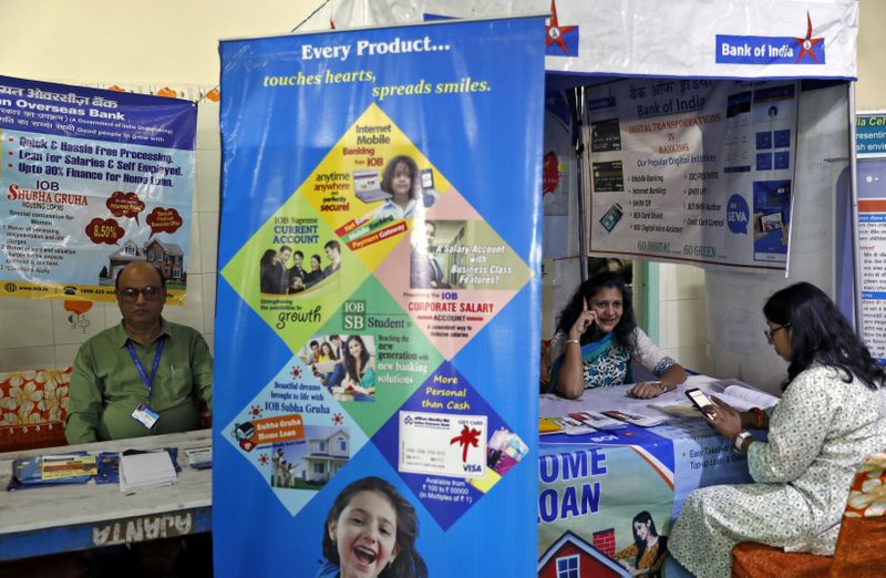 Bank employees wait for customers to offer loans at a 