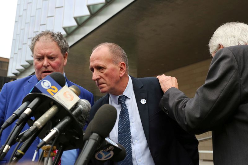 British cave diver Vernon Unsworth talks to reporters with attorneys after a U.S. District