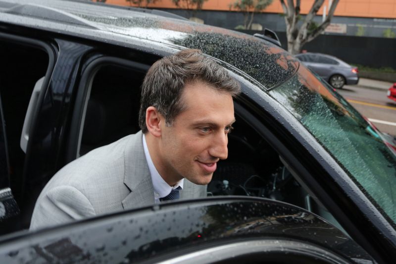 Defendant Attorney Alex Spiro gets into a car after a U.S. District Court jury found Tesla Inc