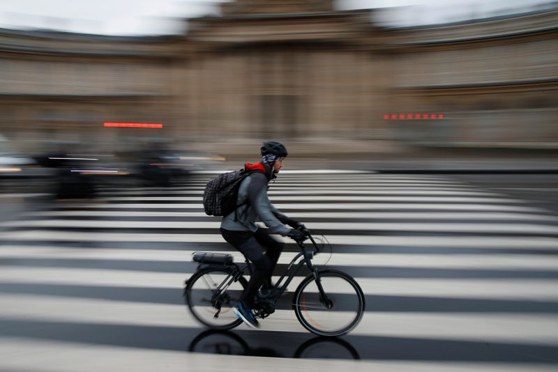 People ride bicycles as a strike by all unions of the Paris transport network (RATP) and French