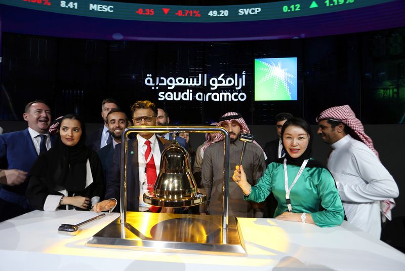 Participants attend the official ceremony marking the debut of Saudi Aramco's IPO on the