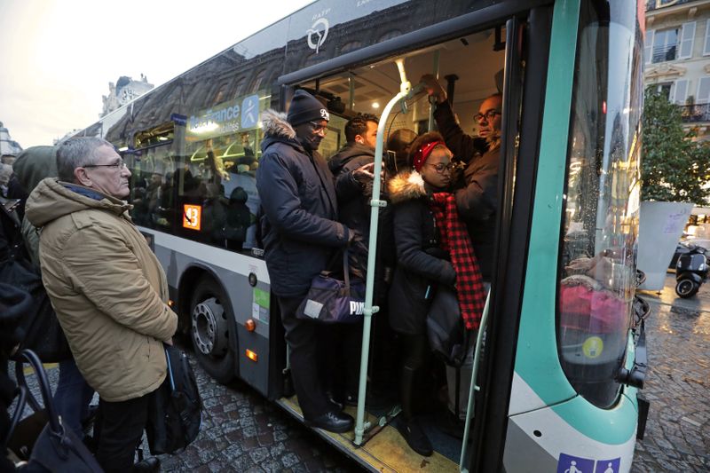 A person rides bicycle during rush hour as a strike by all unions of the Paris transport