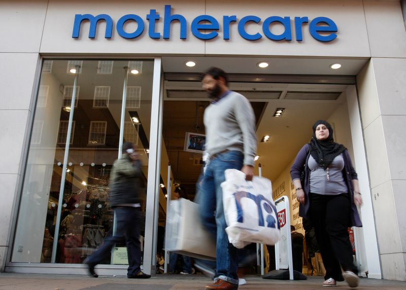 Customers leave a Mothercare shop in London