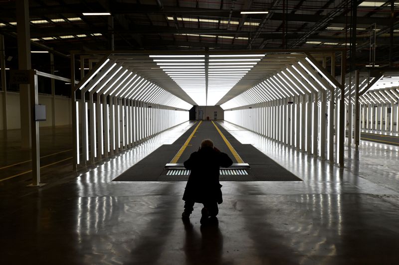 FILE PHOTO: A guest is pictured inside the new Aston Martin Lagonda factory in Saint Athan