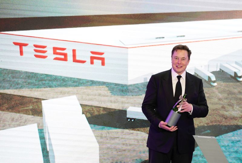Tesla Inc CEO Elon Musk and Shanghai's Mayor Ying Yong attend an opening ceremony for Tesla